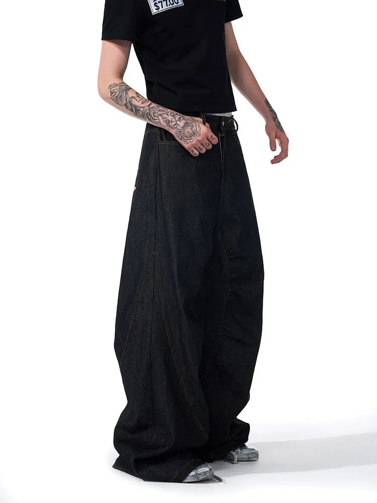 Black wide-leg women's jeans with colour-changing embroidery, shown in a loose straight fit.