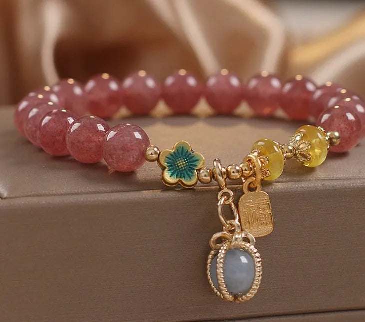 Red strawberry quartz beaded bracelet with alloy setting and rhinestone decoration