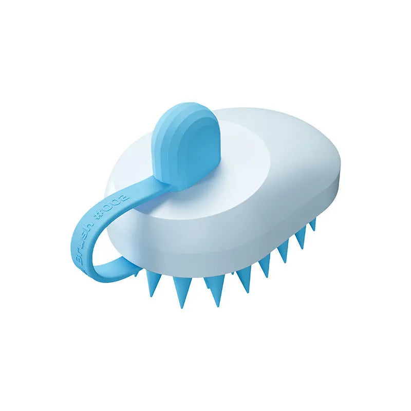 Soft silicone pet hair remover and massage brush for dogs in blue, held in hand.