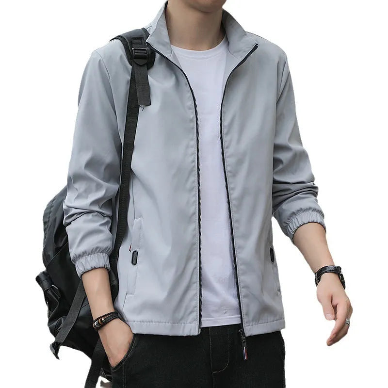 Korean-style loose lapel autumn jacket in navy blue with zipper pockets, shown on model for size reference