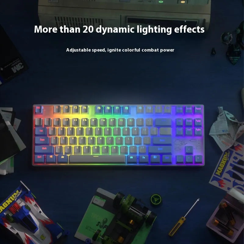 Wireless mechanical keyboard with metal frame in blue-white colour scheme showing backlit keys and USB-C charging port