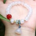 Hand-woven natural white agate bracelet with Chinese lotus seedpod design and 10mm geometric beads