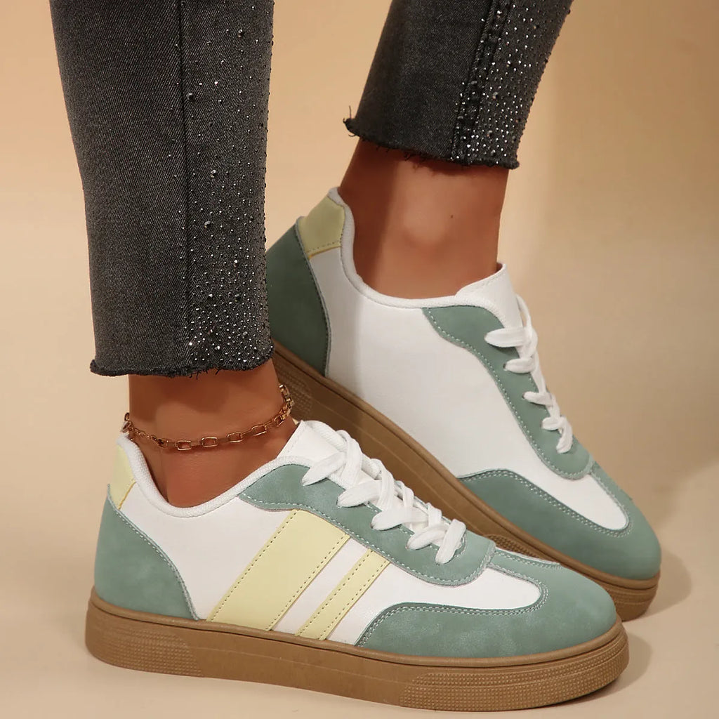 Women's low-top retro sports pumps in a candy colour with cross-strap detail on artificial PU upper.
