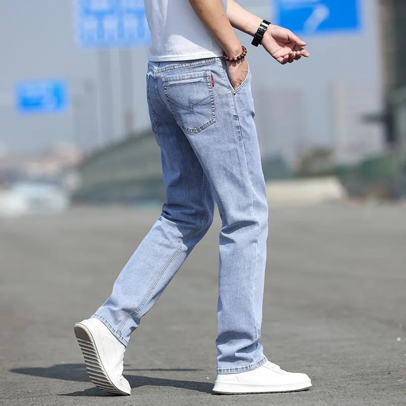 Men's straight leg jeans in smoky gray with low waist and zipper fly closure