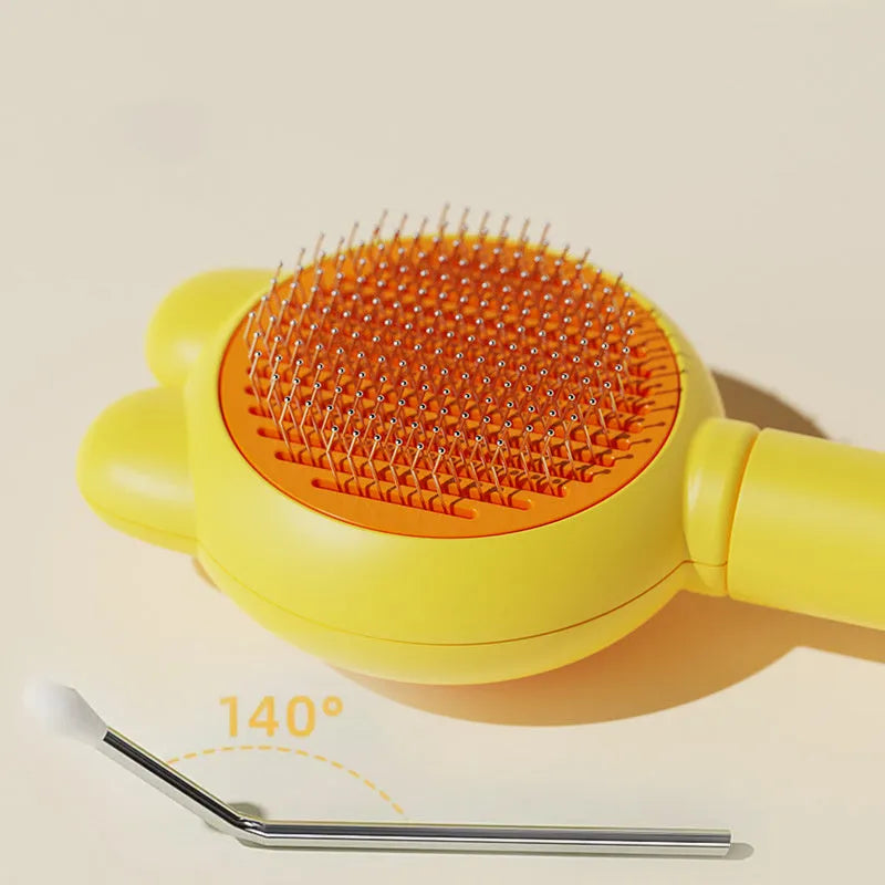 Cat grooming brush with green handle, self-cleaning button, and stainless steel comb for pet hair removal