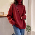 Women's loose-fit grey turtleneck sweater with thick curling pile collar, made of polyester mesh fabric.