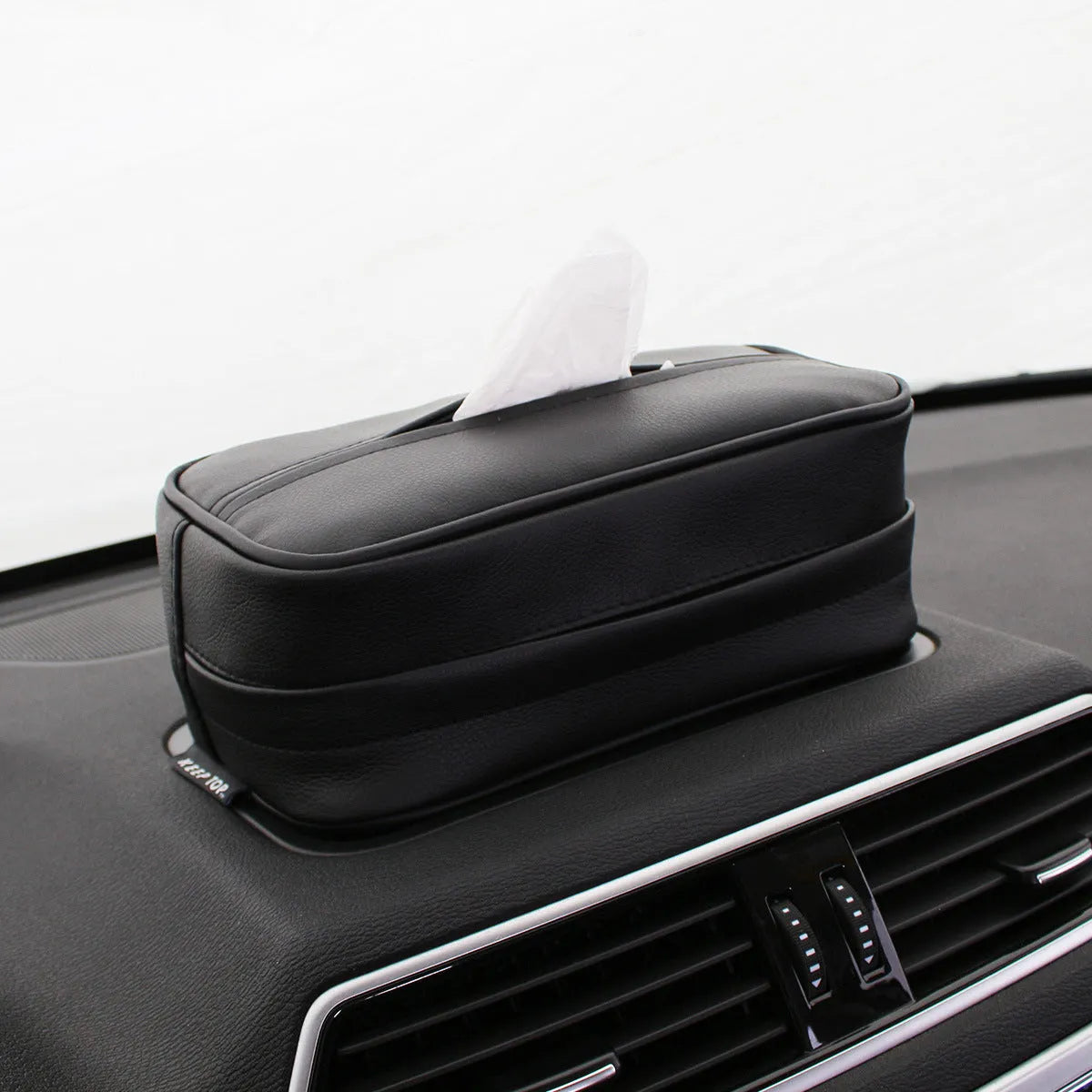 Black PU hanging leather box measuring 23x13x9cm with hanging loop for car storage