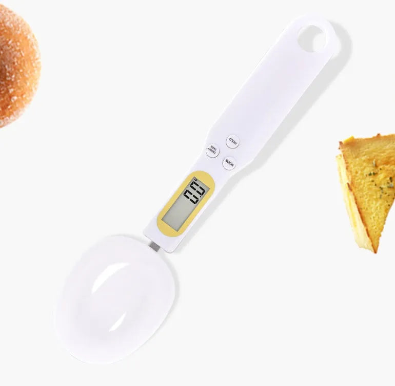 Black electronic measuring spoon scale showing digital display with 0.1g precision for kitchen weighing