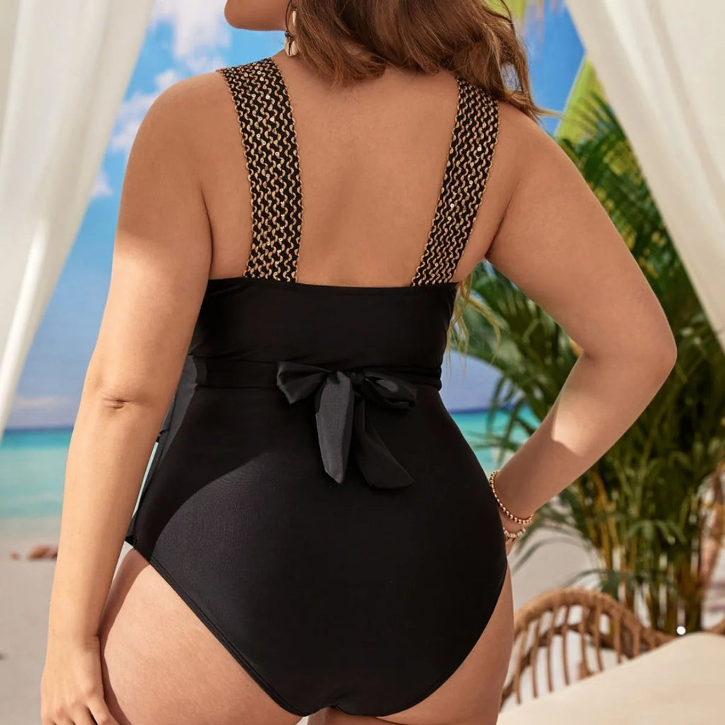 Women's black one-piece swimsuit with sleeveless design and built-in chest pad for swimming support