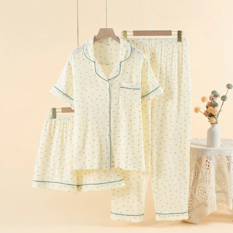 Cotton three-piece pajama set in garden gold with three-quarter sleeves and lapel collar, laid flat