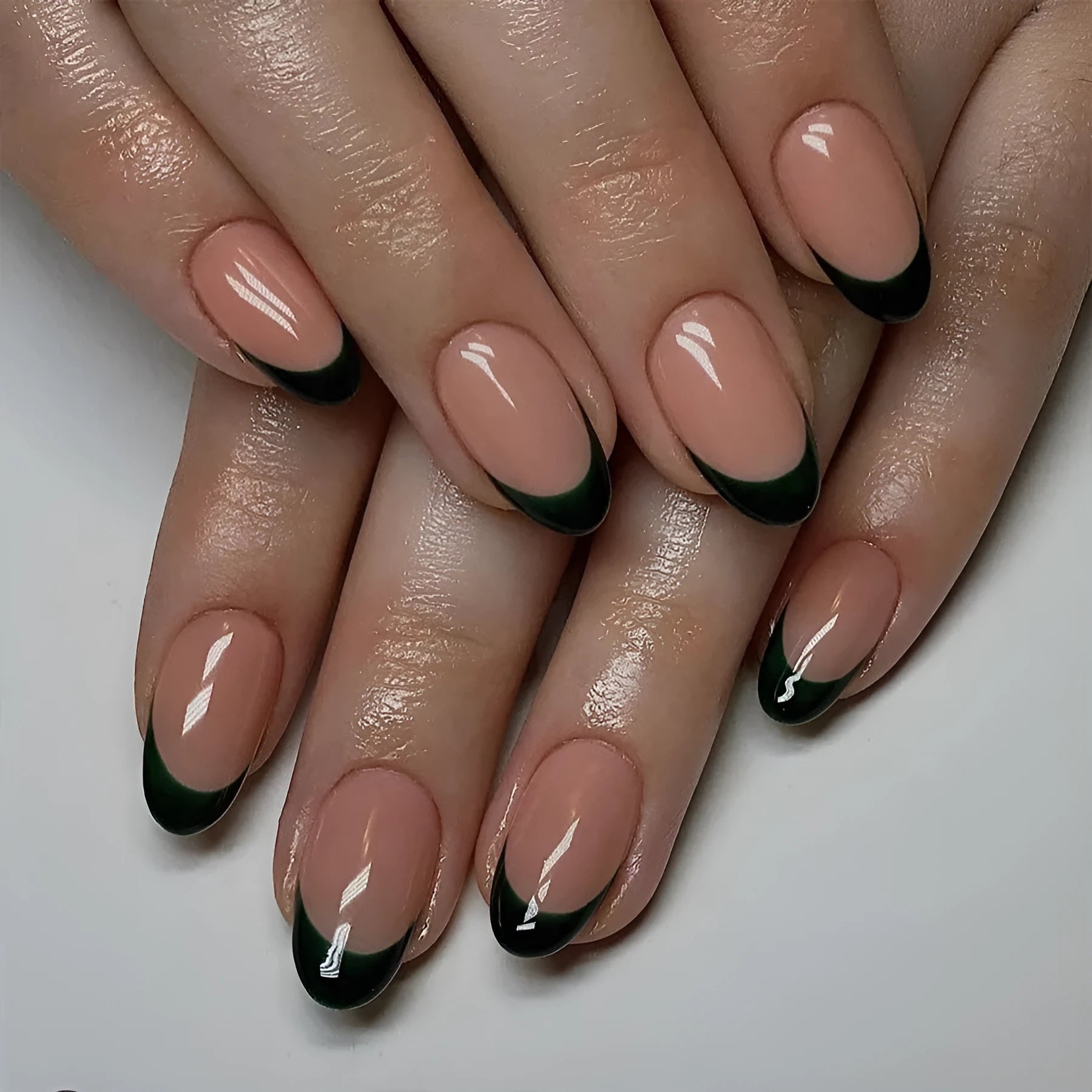 Almond-shaped false nails with black French manicure style, 24-piece set laid out