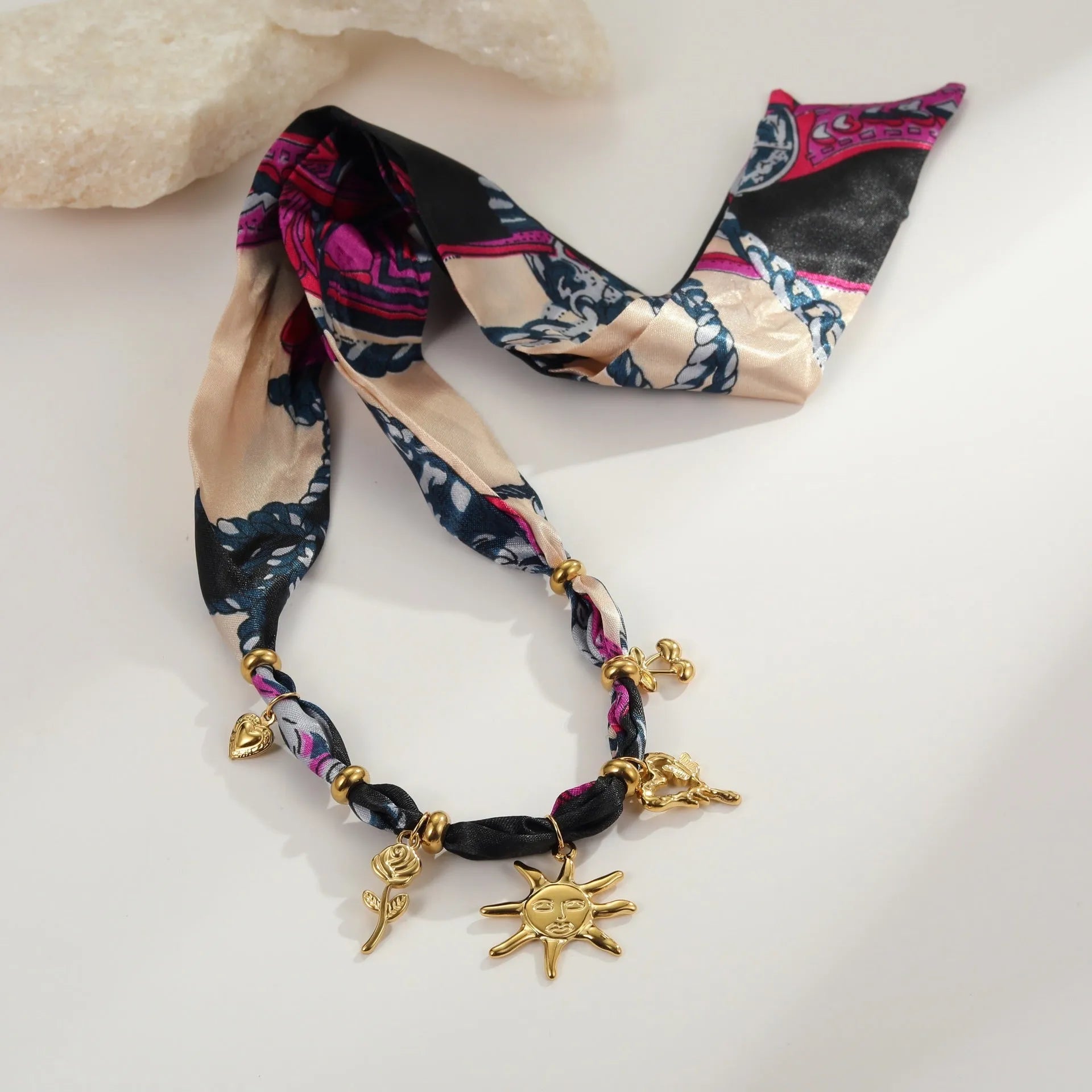 Stainless steel geometric pendant necklace and bracelet set with 18K gold-colour electroplated finish.