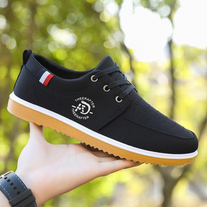 Men's black canvas casual shoes with a leather toe cap, sewing line details, and a thick EVA platform sole.