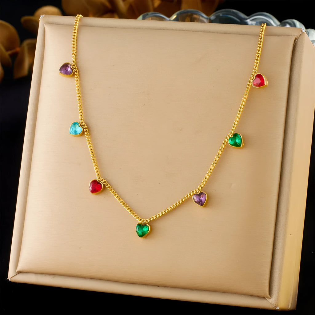 Gold-coloured stainless steel necklace with a heart pendant on an adjustable chain.
