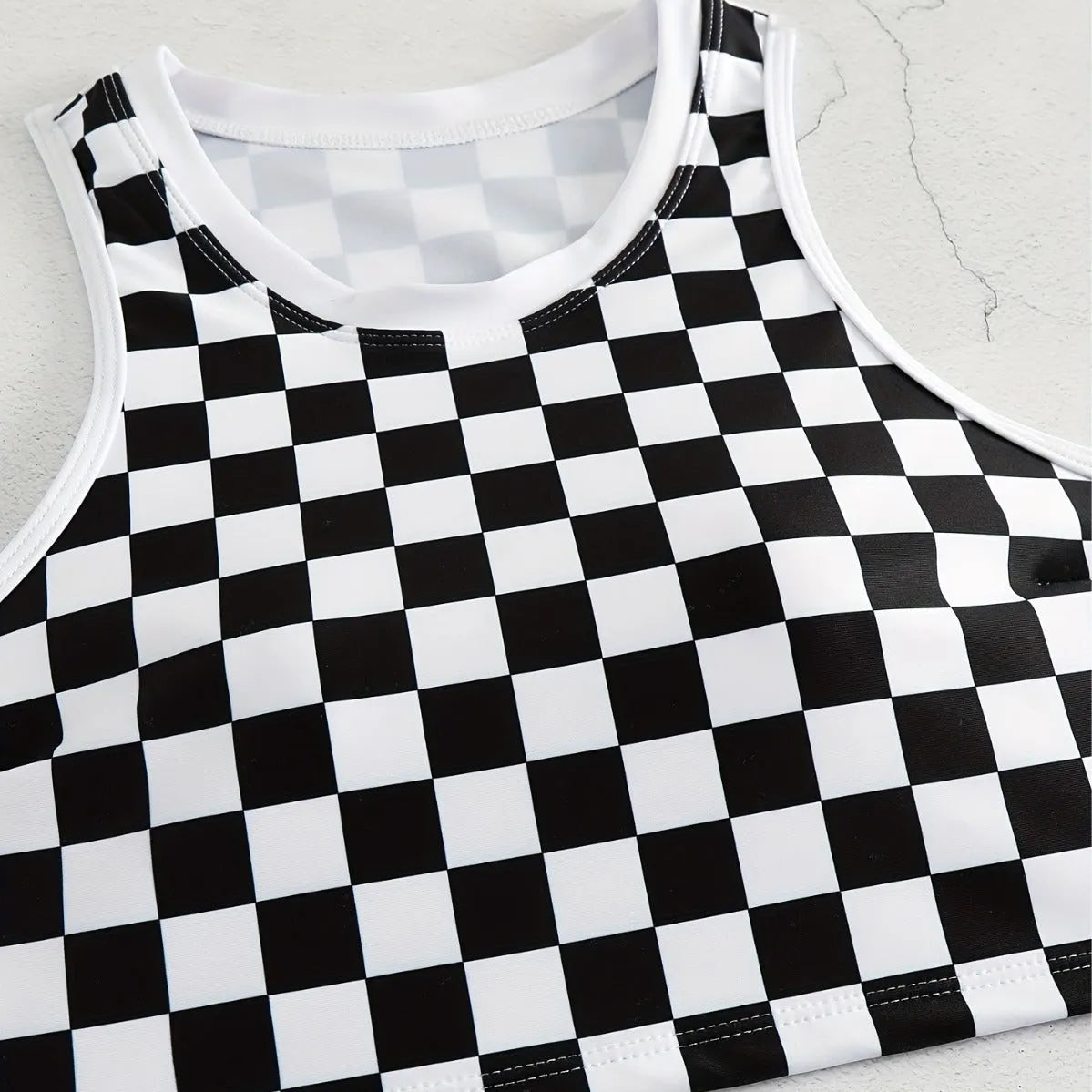 Women's check pattern racing swimsuit with backless suspender design in polyester fabric