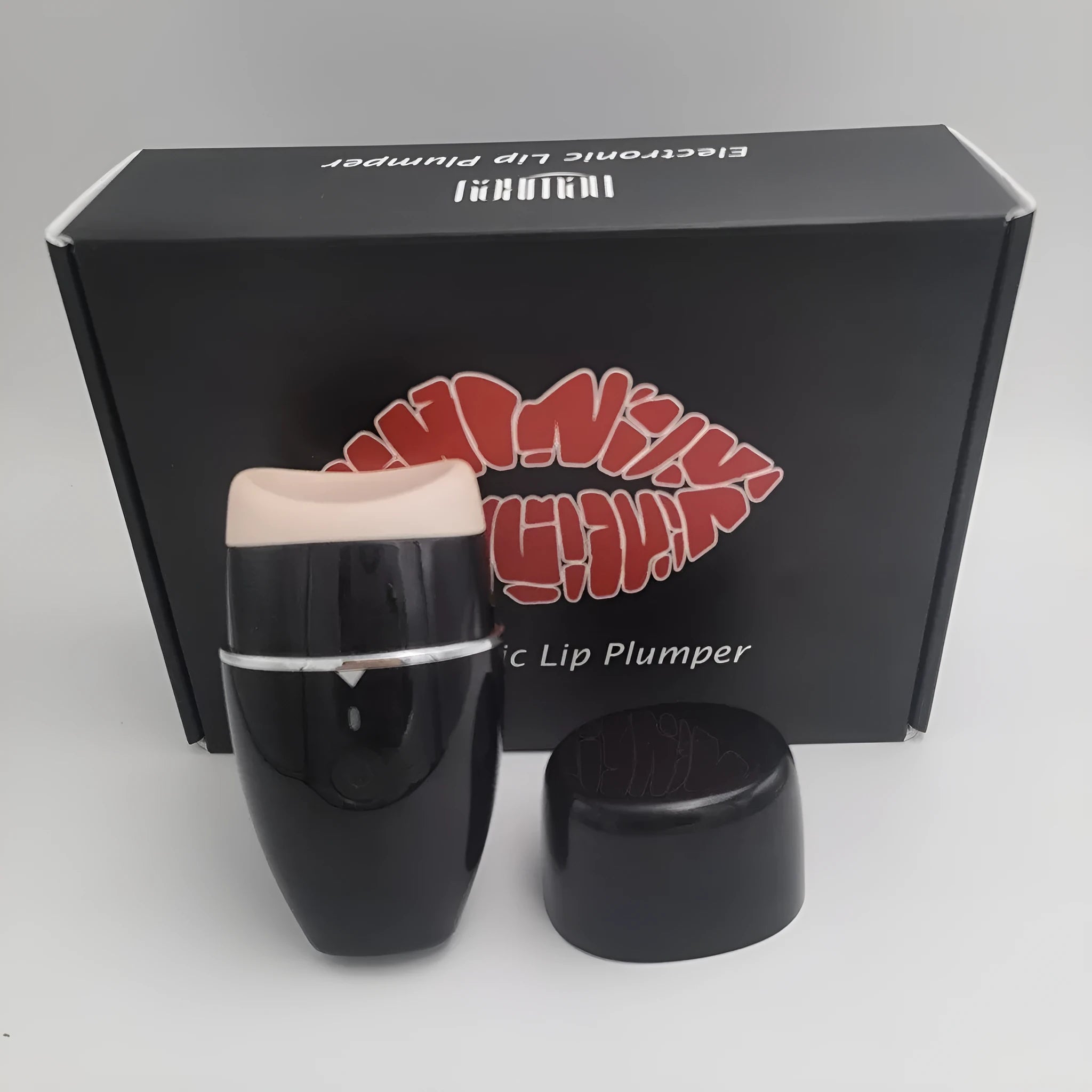 Black electric lip plumper with silicone nozzle and USB cable