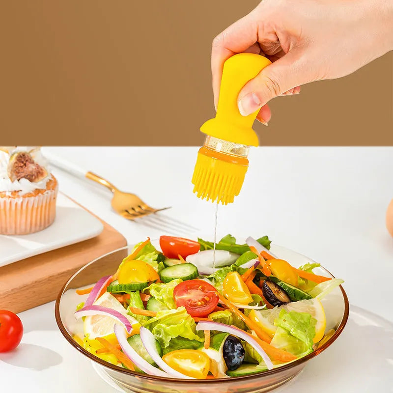 Yellow, green, and brown 550ml glass oil dispenser with silicone brush and stainless steel nozzle.