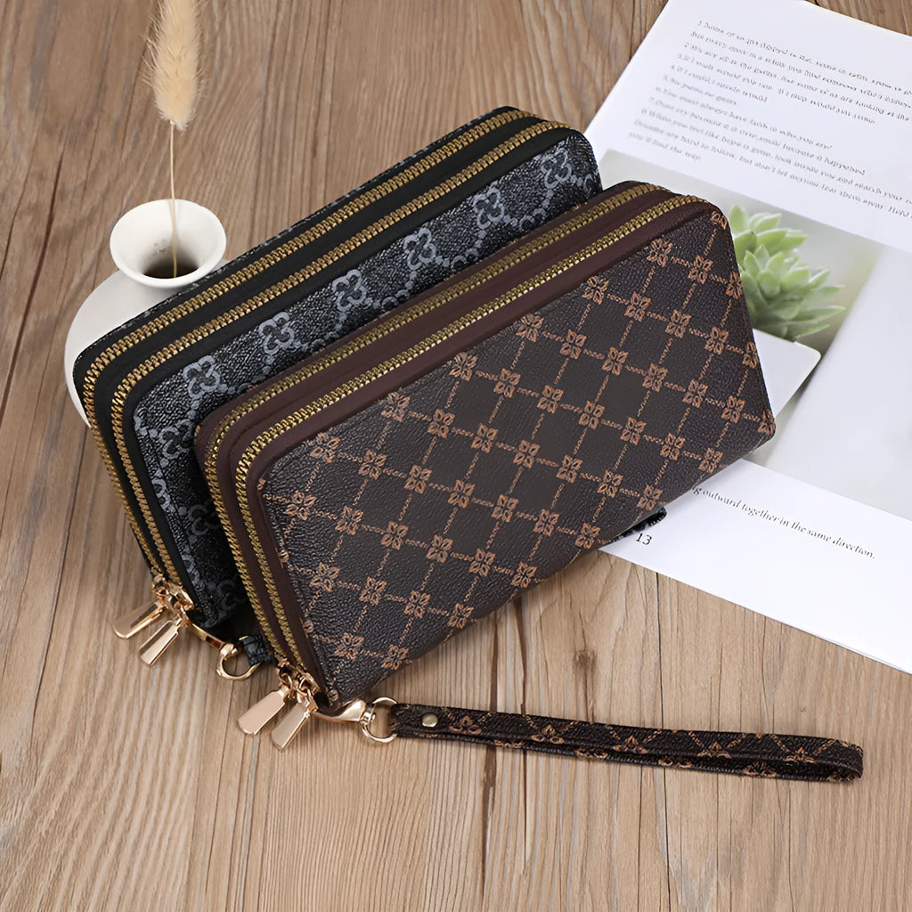 Retro style long wallet clutch in PU leather with a print design, shown in black colour.