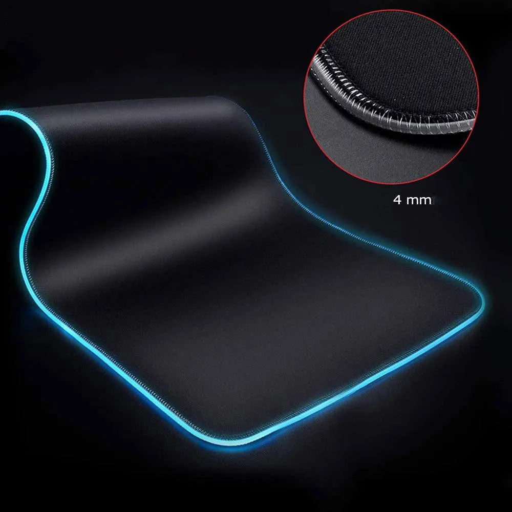 Symphony RGB luminous mouse pad with starry sky pattern lit by USB-powered LEDs on a desk.