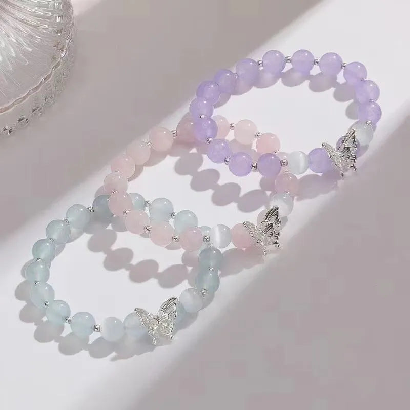 Women's crystal butterfly bracelet with cat eye design in bow shape showing three colour options