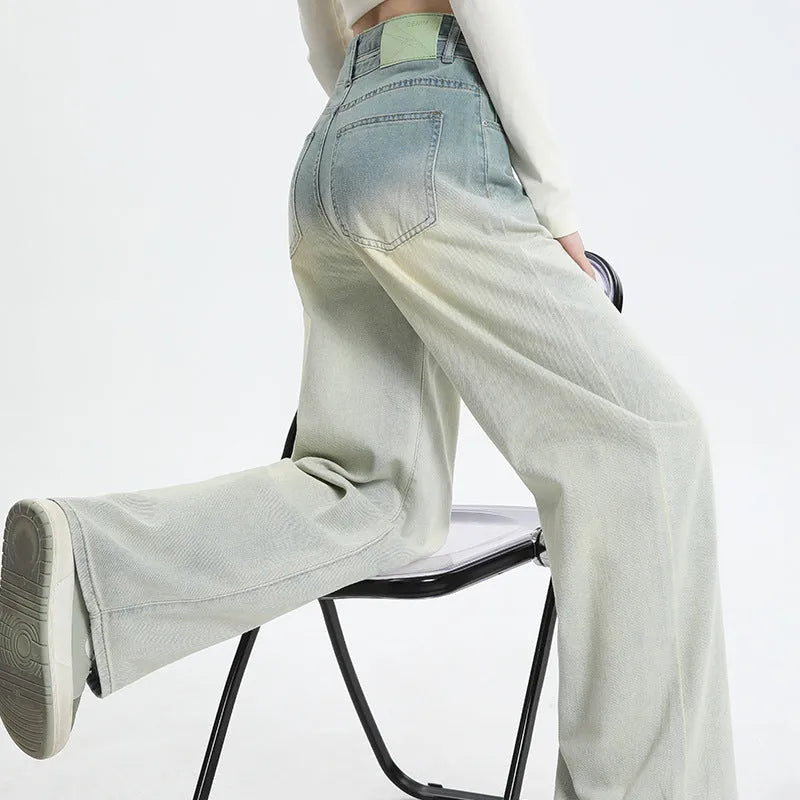 Women's gradient blue straight-leg denim trousers showing colour transition and straight cut silhouette