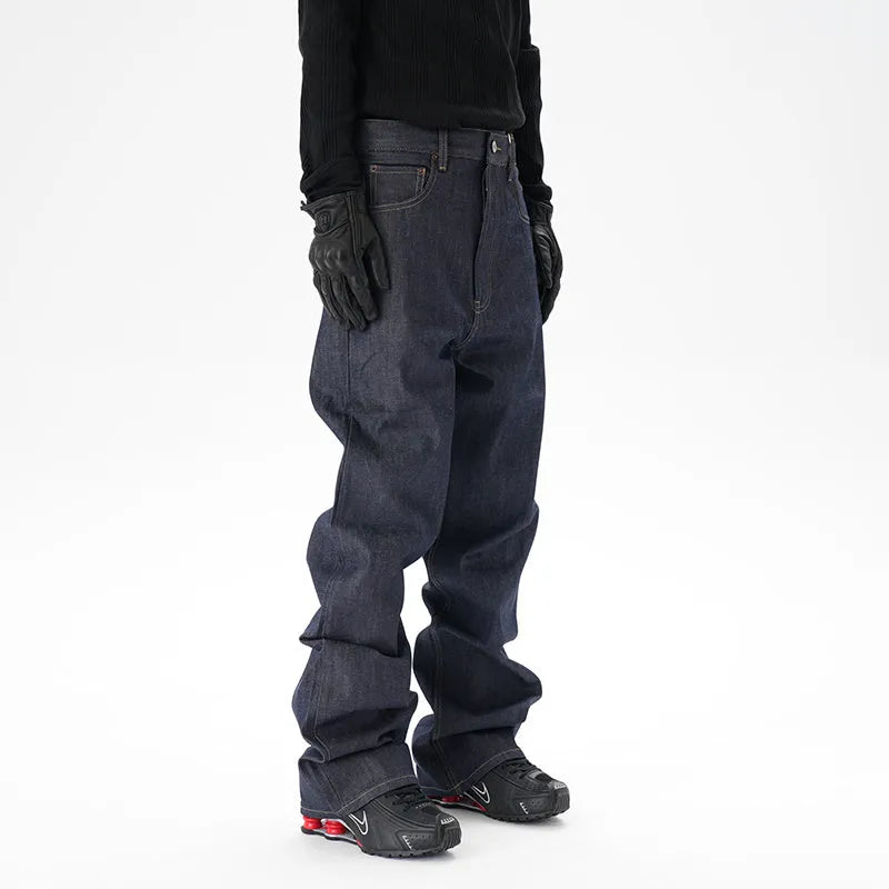 A pair of dark blue loose straight-leg men's jeans on a plain background.