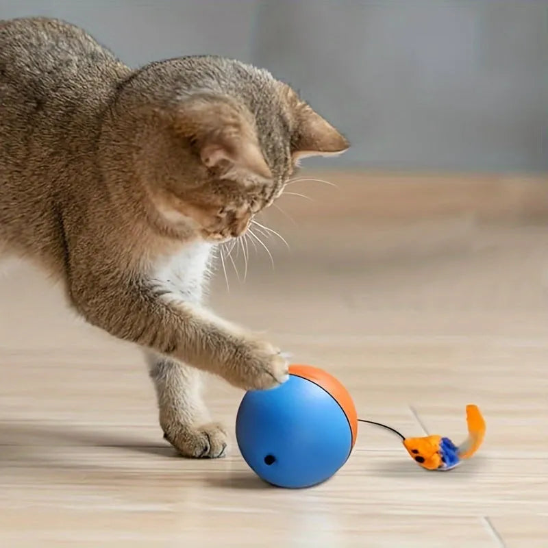 Interactive cat toy with orange rotating ball on grey plush mouse base, showing 8.5cm diameter