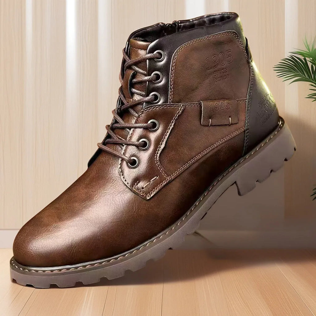 Men's brown ankle boot with a side zip and round toe on a rubber sole