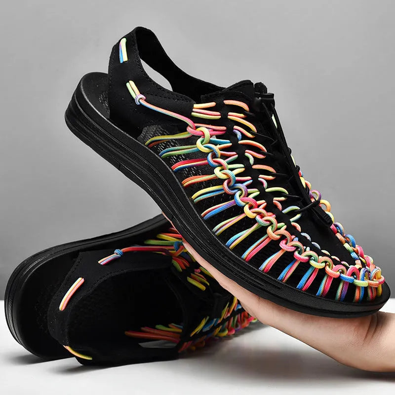 Woven sandals with elastic drawstring tie in rainbow colour, showing rubber sole and net cloth lining