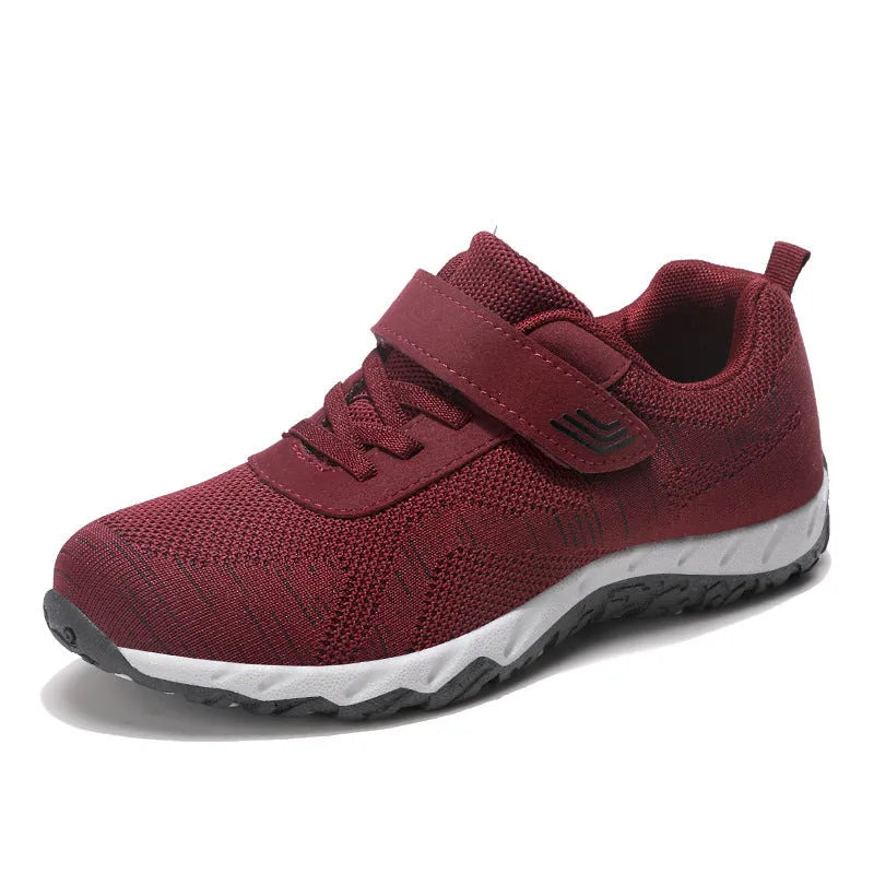 Women's low-top wedge shoes with Velcro strap and mesh upper in a solid colour