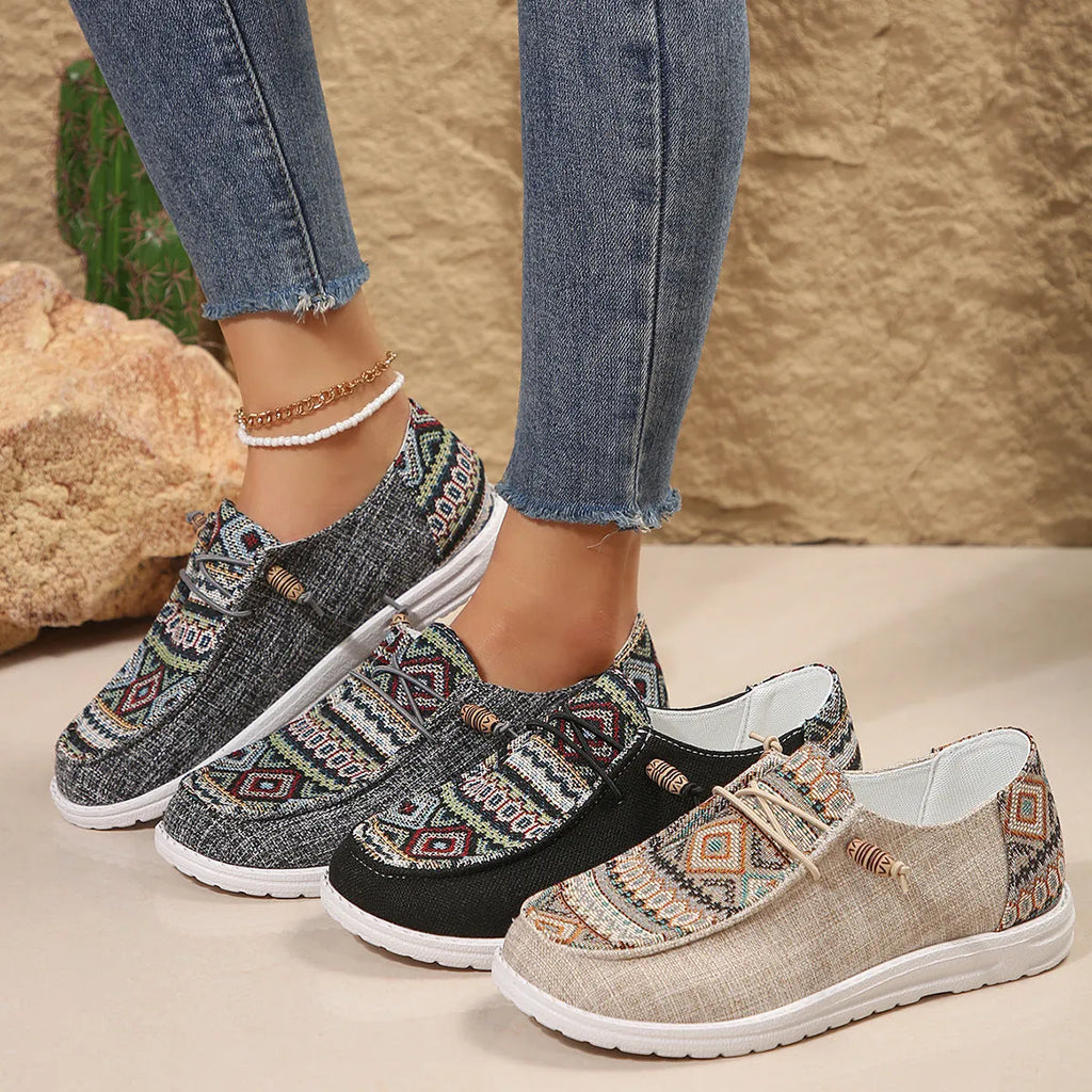 Women's black round toe flat shoes with low-top design and rubber soles