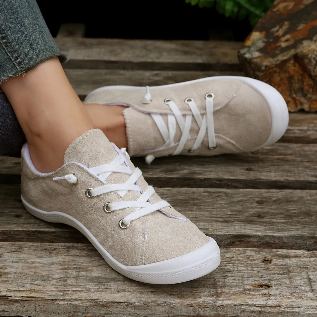 Women's creamy-white casual sneakers with fabric upper and rubber sole, low-top design for versatile wear