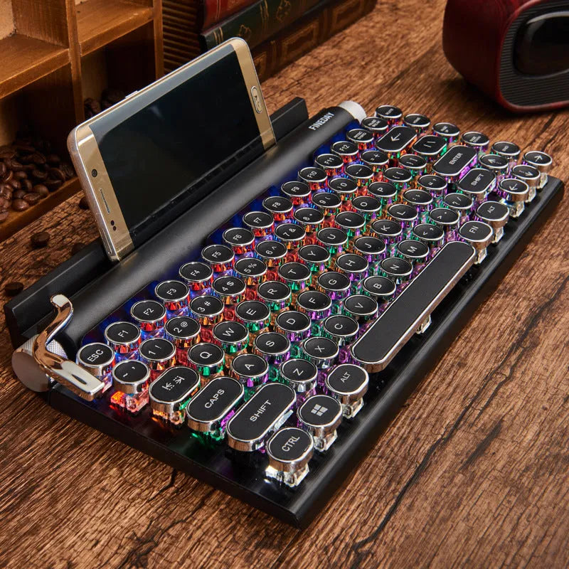 Black Dot retro typewriter mechanical keyboard with 83 keys, seven-colour backlight, and Bluetooth connectivity on a desk