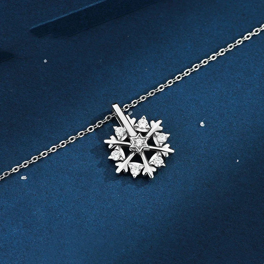 Rotatable S925 silver snowflake necklace for women with rhinestone detail, available in rose gold or white gold.