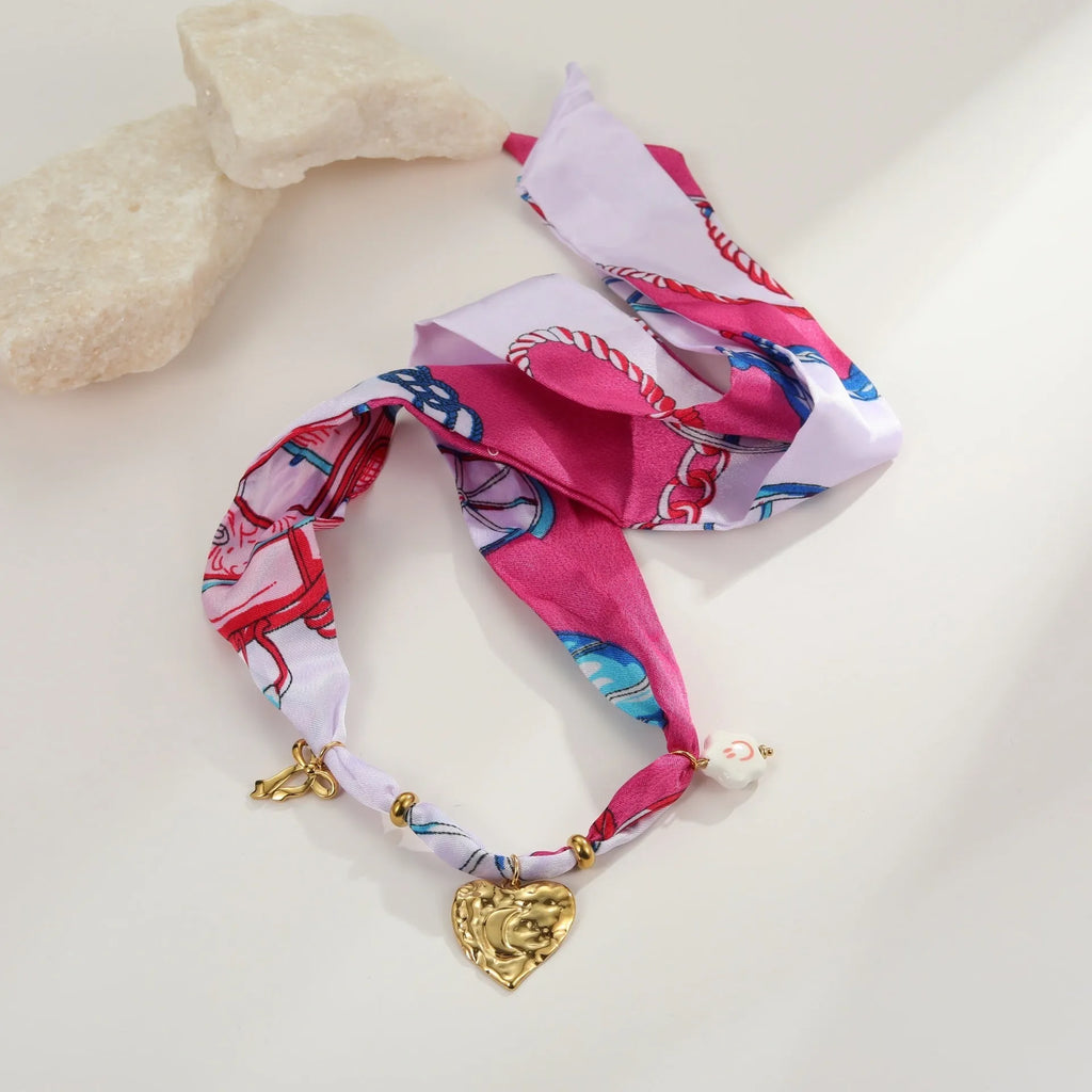 Geometric love pendant necklace and matching bracelet set with colourful silk scarf design on 18K stainless steel chain.