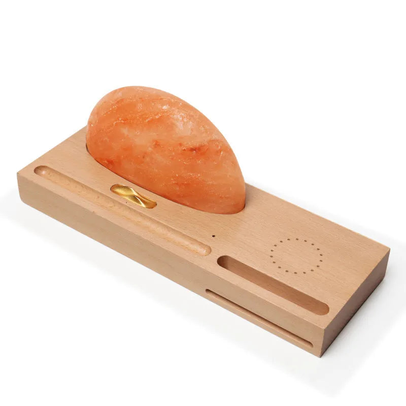Wireless charging salt lamp with natural crystal salt shade on a solid beech wood base.