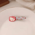 Red three-dimensional love heart-shaped hair barrette with retro dots and a willow leaf design.