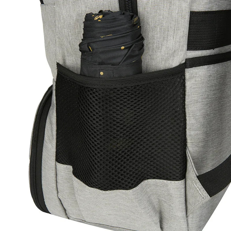 Light grey Oxford cloth backpack with curved shoulder straps showing sewing line details and dry-wet separation compartments