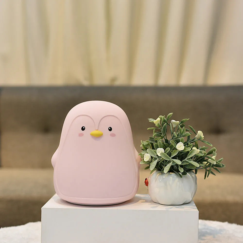Penguin night light with rechargeable battery, silicone ABS construction, white LED light