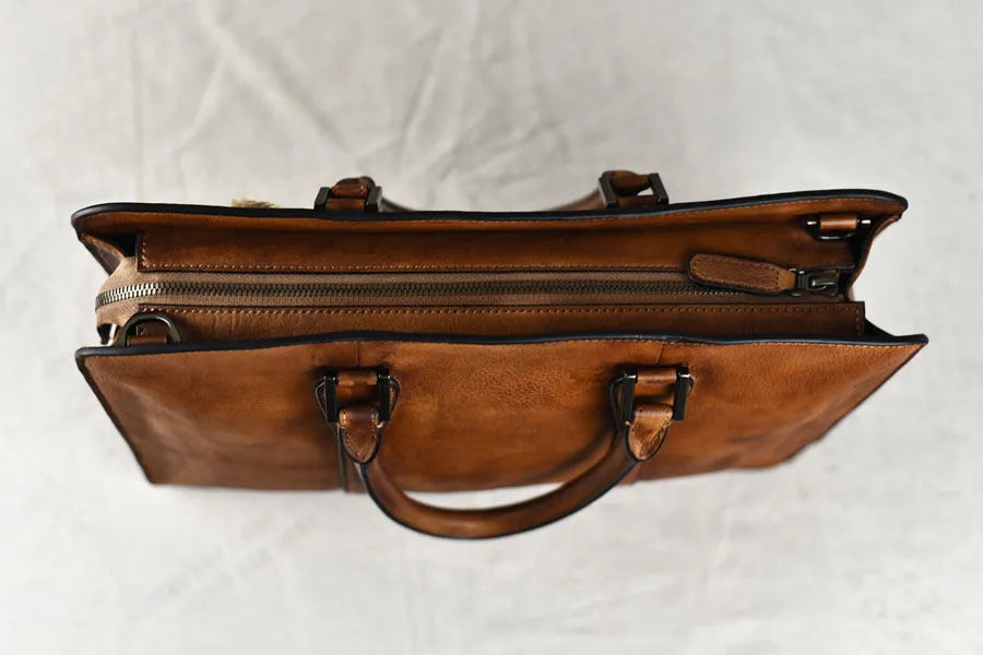 Men's 14-inch horizontal leather handbag with zipper opening in khaki colour, showing vegetable-tanned cowhide texture