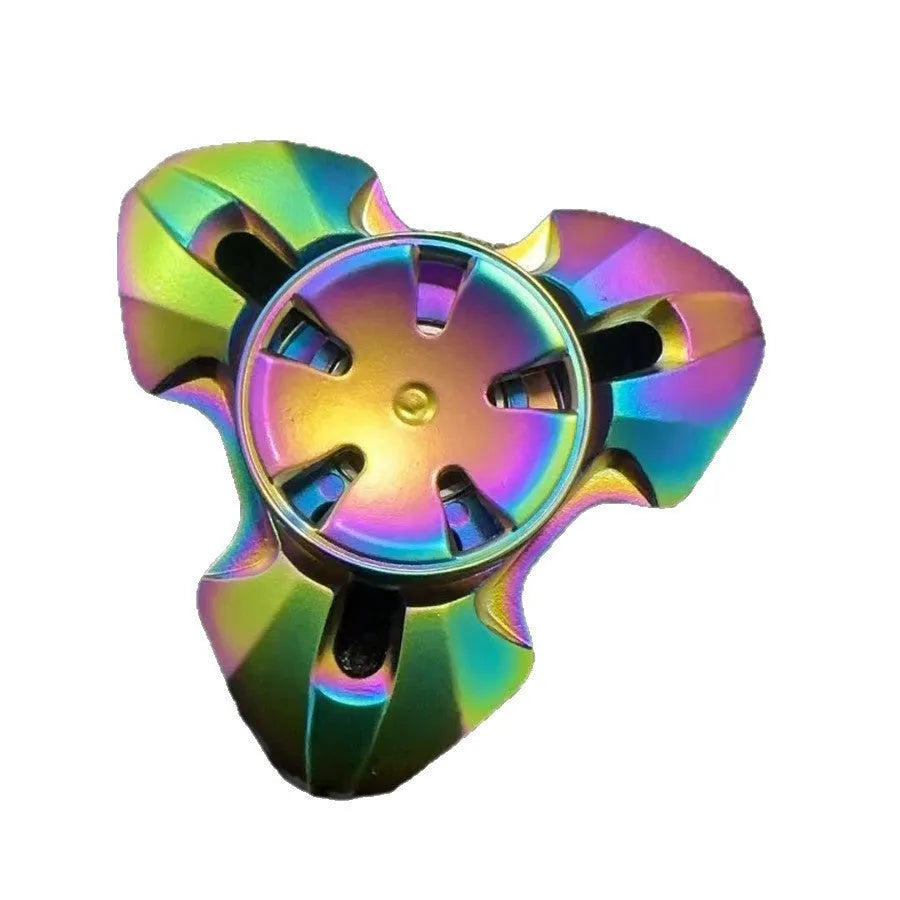 Alloy metal decompression rotating fingertip gyro toy in gun colour and colourful options on a solid background.