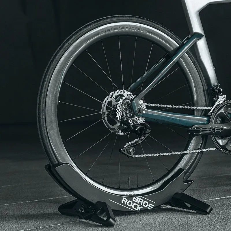 Black ABS plastic bicycle parking rack holder mounted on wall