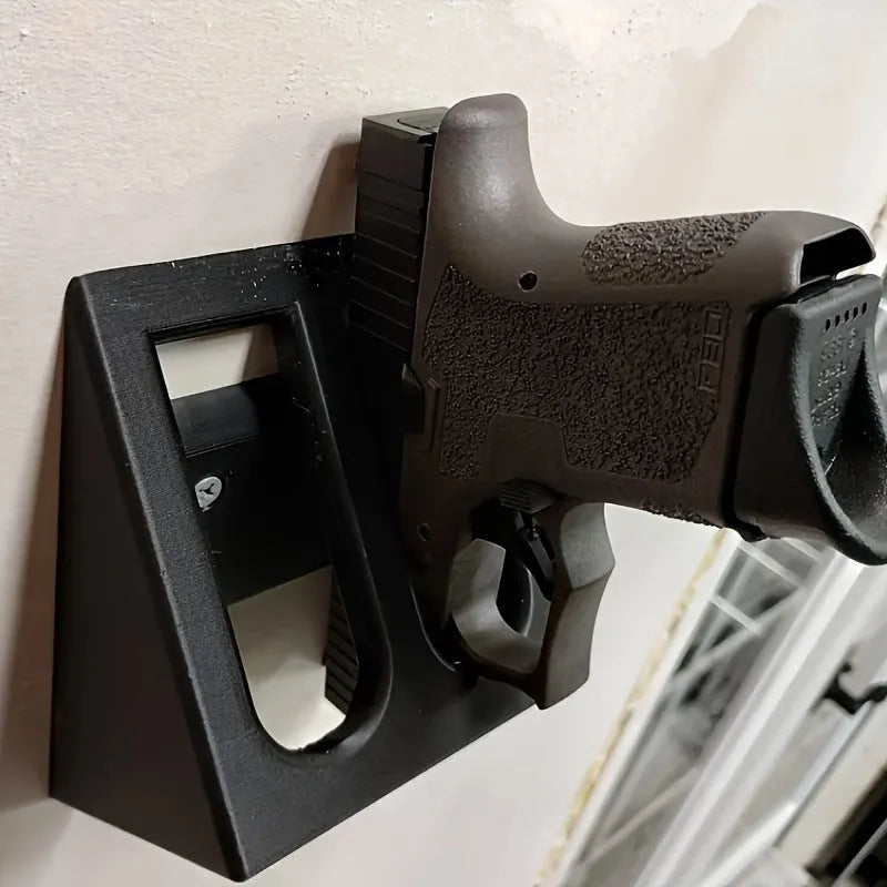 Black plastic pistol stand for displaying collectible firearms, dimensions 10.85 x 7.6 cm