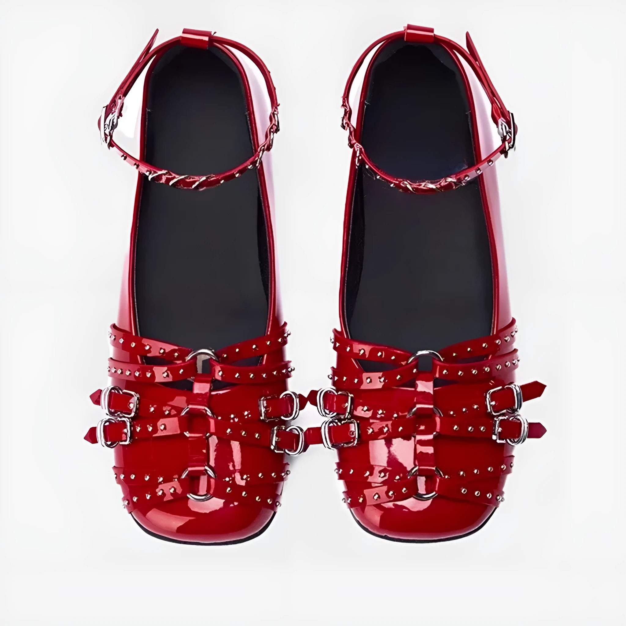 Women's black patent leather square-toe pumps with a buckle fastening and low flat heel.