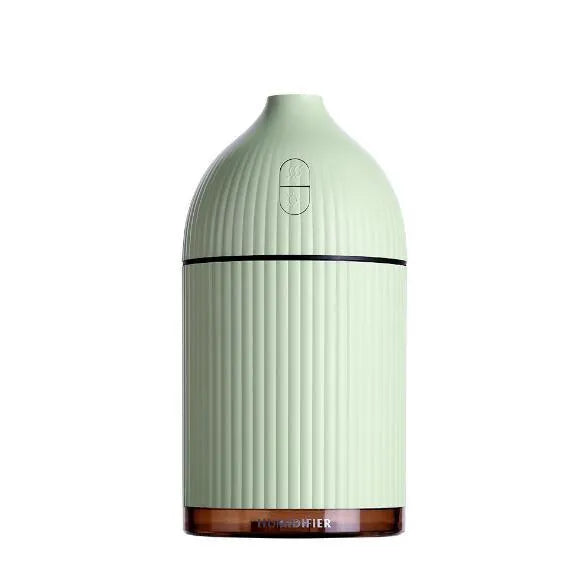 White ultrasonic aromatherapy diffuser with LED light, 300ml capacity, and USB cable on a wooden table