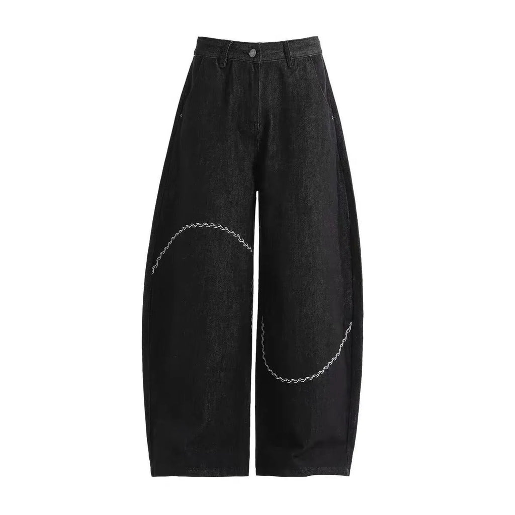 Black straight-leg denim trousers with mid-waist and zip placket on hanger showing micro-elastic polyester fabric