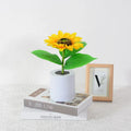 Rechargeable artificial sunflower LED night light on a table