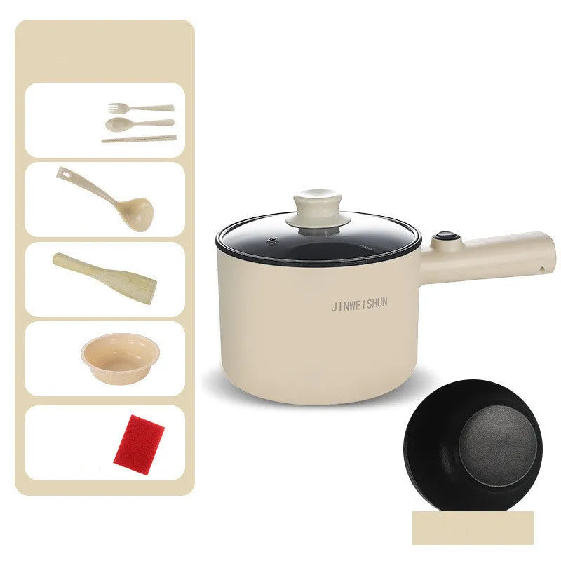 White and green mini electric hot pot cooker with stainless steel body and cooking accessories on a kitchen counter.