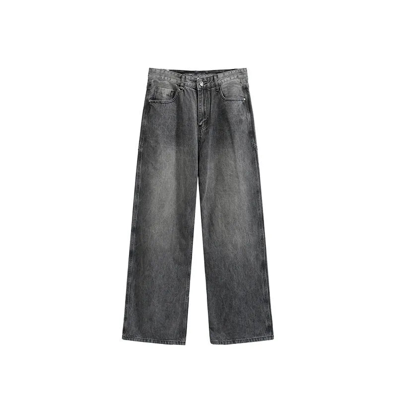 Man wearing washed vintage blue wide leg jeans with a straight leg and mid-waist cut
