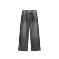 Man wearing washed vintage blue wide leg jeans with a straight leg and mid-waist cut